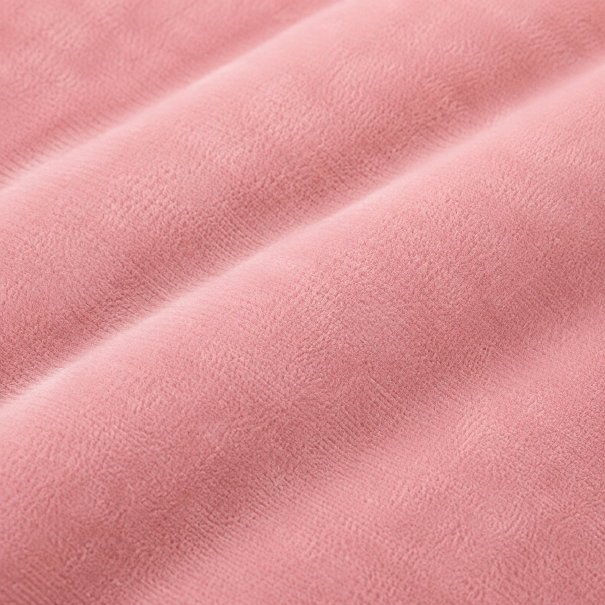 Detalle del tejido rosa de la almohada de embarazo