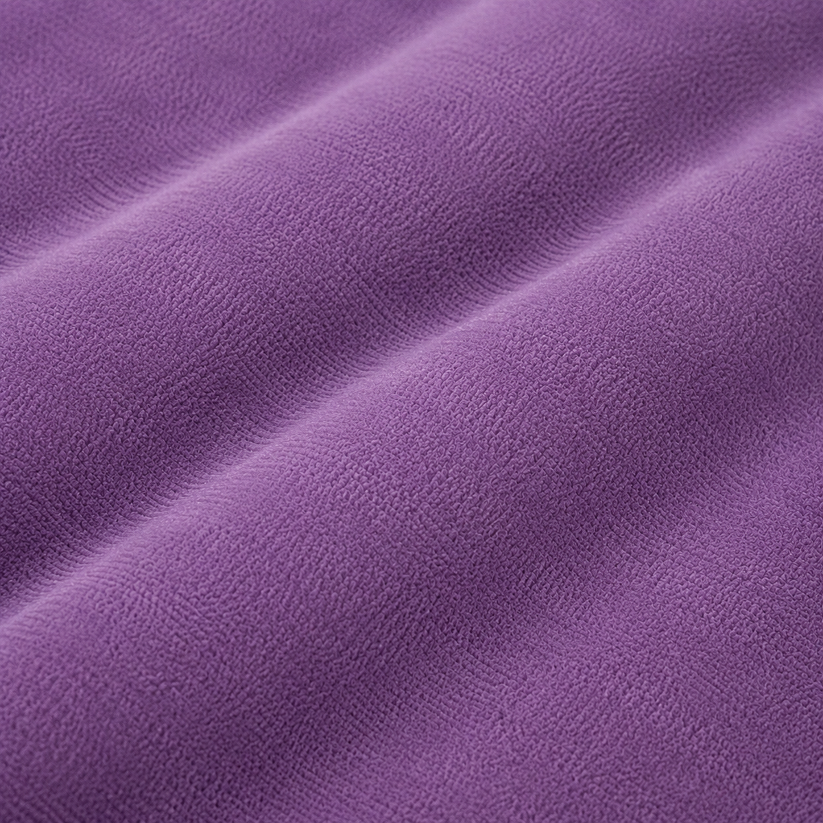Detalle del tejido violeta de la almohada de embarazo